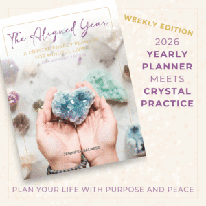 The Aligned Year 2026 Weekly Planner with Celestite heart cover and gold border on ivory background.