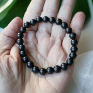 Shungite crystal bracelet with polished black 8mm beads, handmade energy protection jewelry for grounding and EMF shielding