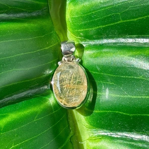 Gold Rutilated Quartz pendant in sterling silver. Inspires confidence, clarity, and radiant manifestation energy.