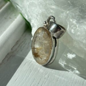 Gold Rutilated Quartz pendant in sterling silver. Inspires confidence, clarity, and radiant manifestation energy.
