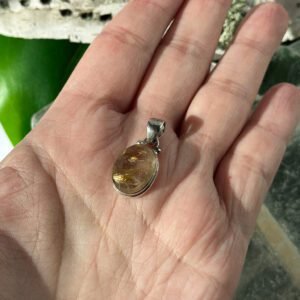 Gold Rutilated Quartz pendant in sterling silver. Inspires confidence, clarity, and radiant manifestation energy.