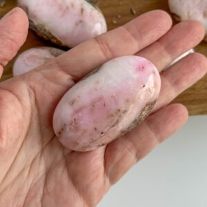 Pink Aragonite palm stone with soft pink and cream patterns, heart-healing crystal for emotional support and self-compassion