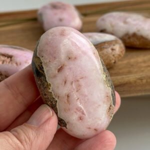 Pink Aragonite palm stone with soft pink and cream patterns, heart-healing crystal for emotional support and self-compassion