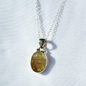 Gold Rutilated Quartz pendant in sterling silver. Inspires confidence, clarity, and radiant manifestation energy.